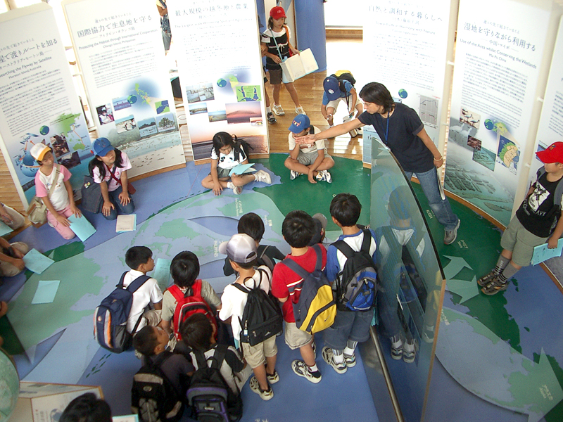 Children are engrossed in learning at the Inae Visitor Center